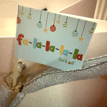 Fa-La-La-La-La Fuck Off flag on a silver bow