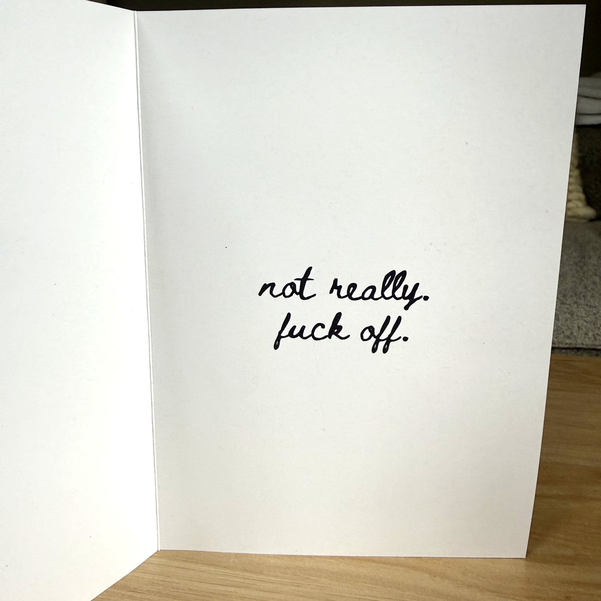 Inside of Very Happy Holiday card reads not really. fuck off.